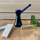 Rolling papers from House of Puff; Upright Bubbler from Jane West; Nomad Pipe from Tetra; Glass Tanjun Pipe by Laundry Day.